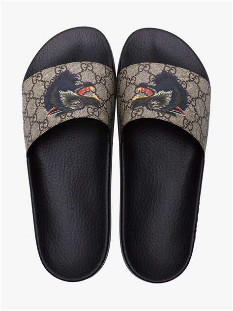 gucci supreme wolf slides|Gucci slides with gold gg.